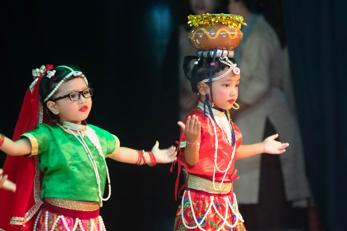 Happy children learning in a classroom